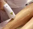 a woman getting a laser on her leg